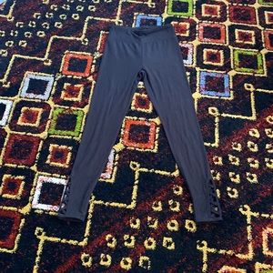 Black leggings with woven detail at ankle size small